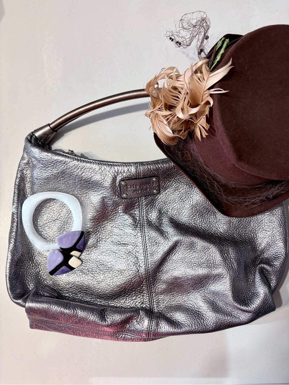Kate Spade Janaya shiny silver hobo bag